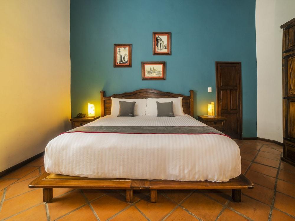 Collection O Al Otro Lado Del Rio, Puebla Hotel Ngoại thất bức ảnh A bedroom at the hotel