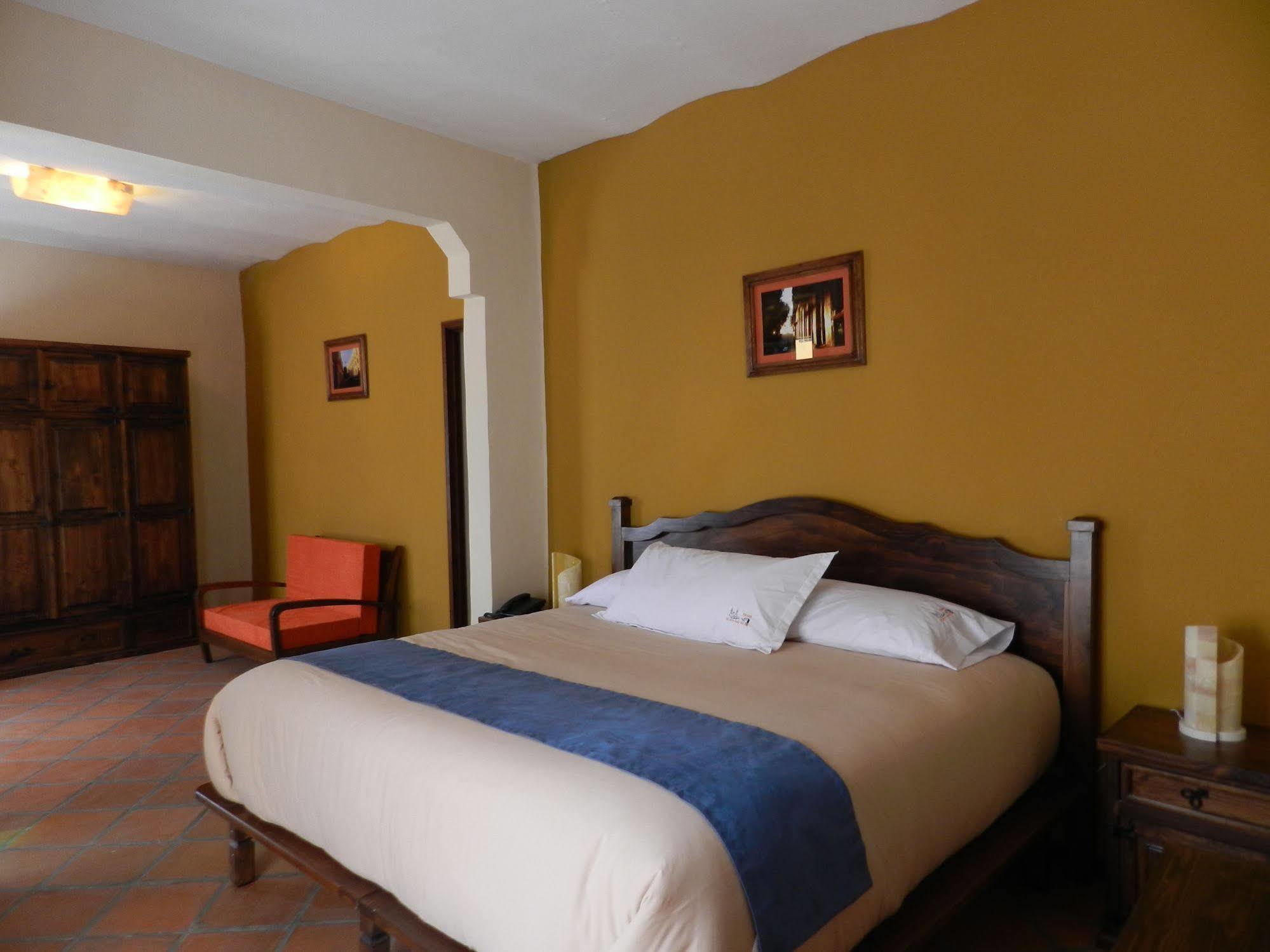 Collection O Al Otro Lado Del Rio, Puebla Hotel Ngoại thất bức ảnh A bedroom at the hotel