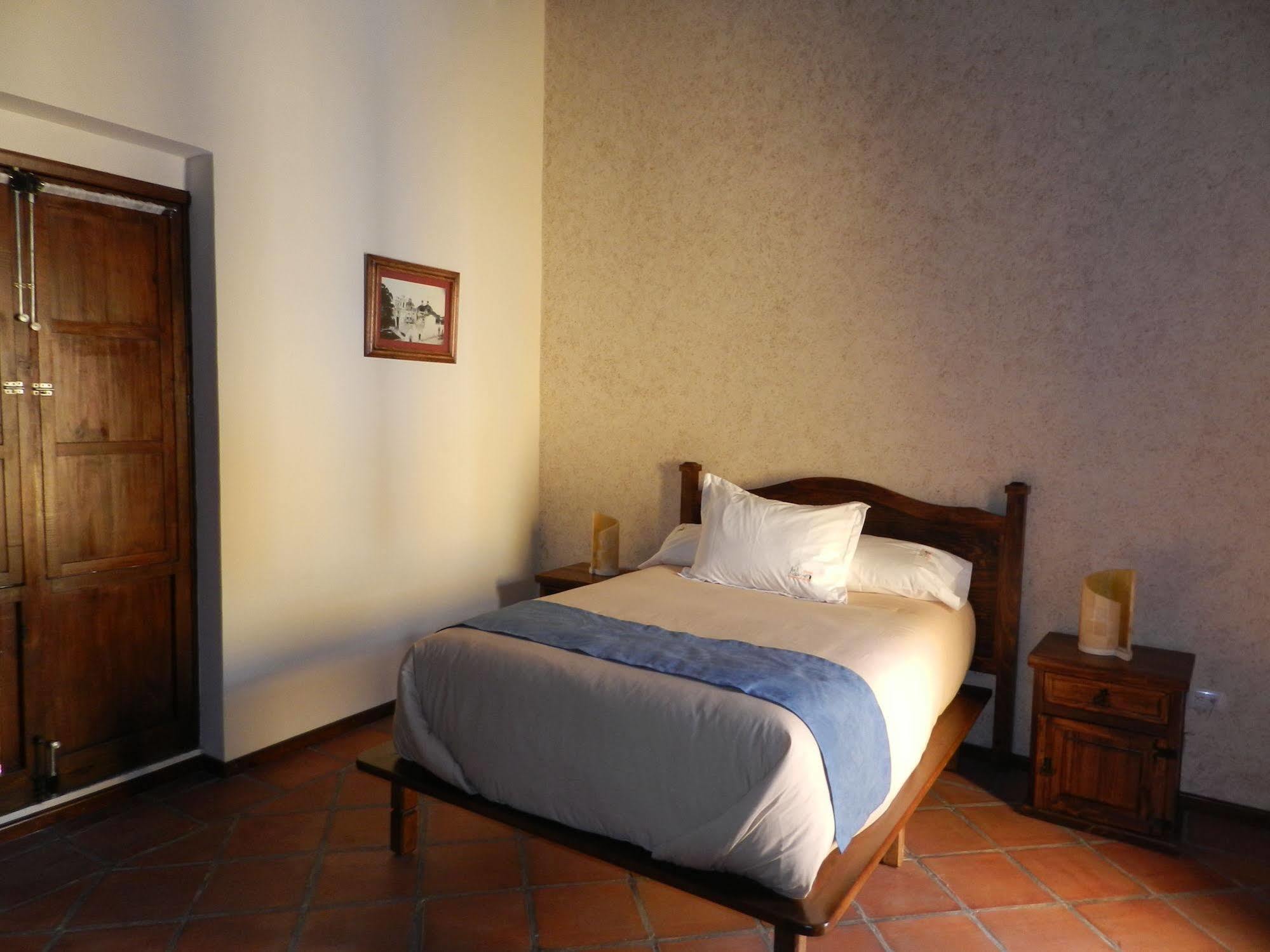 Collection O Al Otro Lado Del Rio, Puebla Hotel Ngoại thất bức ảnh A room at the hotel